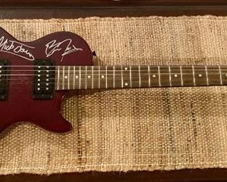 Guitar signed by Foreigner 
Mick Jones, Jeff Pilson, Thom Gimbel, Michael Bluestein, Brian Tichy, and Kelly Hansen