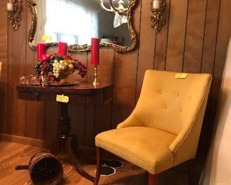 gilded mirror, , wall sconces, claw foot table, upholstered chair 