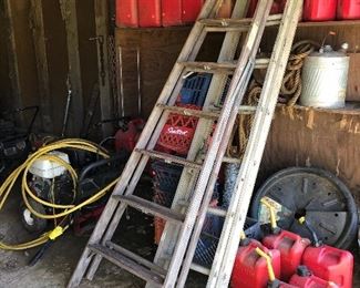 wooden step ladder, milk crates, gasoline cans, aluminum extension ladder