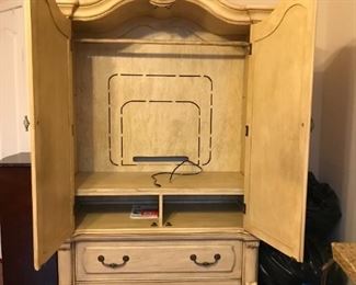 Top space is great for storage or to house a TV.  Electronics can sit below, and there are two deep drawers on the bottom, which slide in & out nicely. 