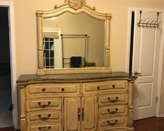 Lots of storage in this long dresser! 8 drawers visible here with 3 more inside the two center doors. The top surface is black speckled marble, and the mirror is detachable. Gorgeous!!
