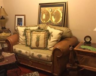 Wait til you see the fun Tommy Bahama-style room! Pineapples and palm tree decor, loveseat, side tables, a fun bench seat, footstools, art, lamps and great accessory pieces!