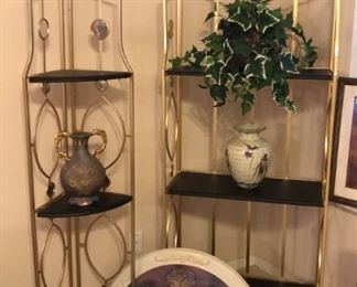 2 black and gold deco shelving units with mirror accents. These are fun and so pretty in person! Ask Gail what she loves most about them!! Corner unit: $75, rectangle unit: $125.