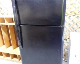 Black Frigidaire refrigerator 65 10/16in H X 30in W X 30in D