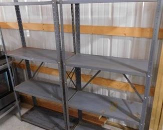 2 blue metal storage racks with 4 shelves- both are 61in H X 30 1/2in W X 12in D