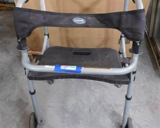 Invacare medical walker has wheels and seat