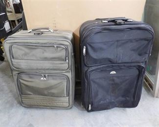 2 Large suitcases both have wheels