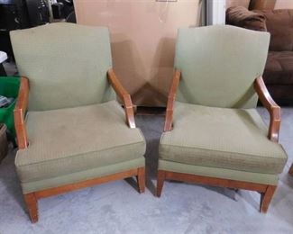 Pair of two green office lounge chairs with wooden arm rests