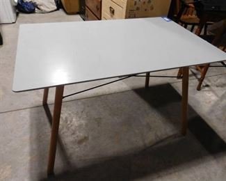 Modern wooden table with minor scratch and chip 27 1/2 H X 43 1/2 X 27 1/2 D