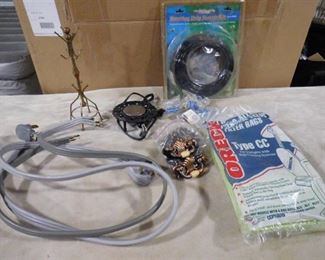 lot of assorted items including dryer cord, vacuum bag, candle warmer and drawer handles