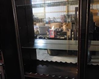 Large mirrored display case- has 4 glass shelves- 79in H X 38in W X 17in D