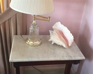 Marble top table with lamp.