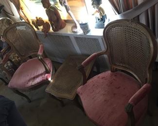 Pink plush cane chairs.