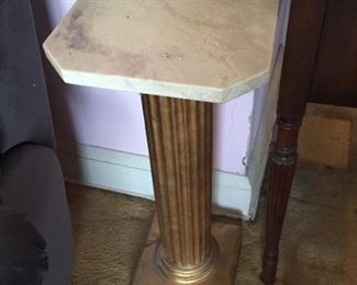 Brass table with marble top.