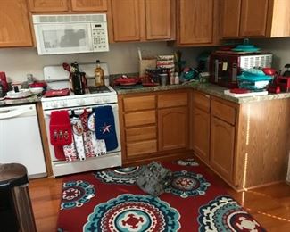 Sandinavian dream.  So many beautiful teal and red cookware items.  