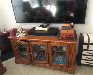Beautiful hardwood TV console with stained /etched glass.  No IKEA particle board junk here.  Priced to go!