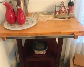 Love, Love, Love Bar Carts, Kitchen Carts.  This one is  Oasis Island.  Bottom shelves pull out for more storage with butcher block top.    It's perfect for a sidebar at a holiday table to store next round or finished plates.