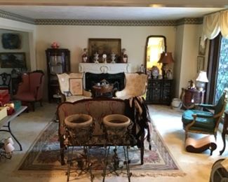 Living Room filled with global treasures and rugs. Chinese Foo Dogs $195, Brass Fireplace Screen $95, Pair of Vintage Chairs $325 / pair, Gilt Antique Chair $895  