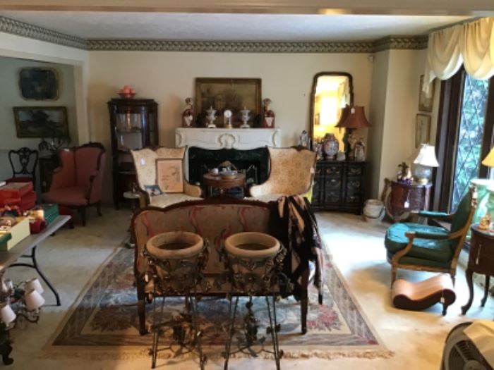 Living Room filled with global treasures and rugs. Chinese Foo Dogs $195, Brass Fireplace Screen $95, Pair of Vintage Chairs $325 / pair, Gilt Antique Chair $895  
