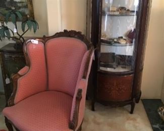 Antique Carved Mahogany and Upholstered Chair $395, Curio Cabinet $850