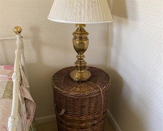 wicker storage table; brass lamp