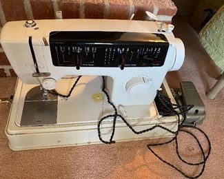 Sewing machine with case