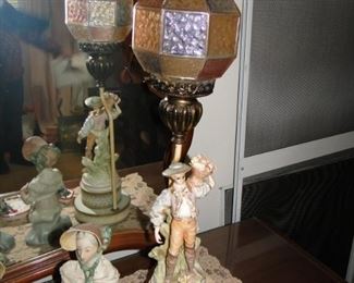Figural lamp with globe