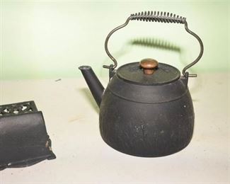 150. Two 2 Cast Iron Items