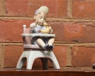 245. LLADRO LITTLE BOY IN HIGH CHAIR RUBBER DUCKY