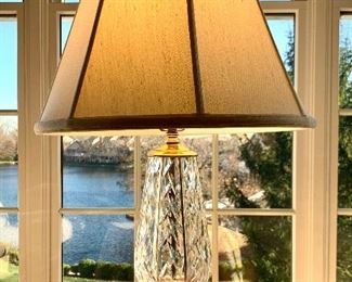 $250. Hallmarked Waterford crystal, table lamp. Shade is a silk blend and measures 28”. Base measures 12x6.
