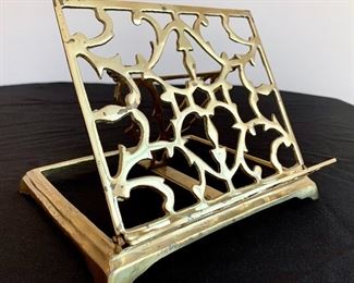 $50. Display your favorite book with this vintage brass folding book stand. Measures 9x9x9.