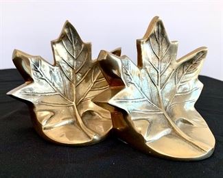 $30. Pair of brass Maple leaf bookends. Measures 5” tall.