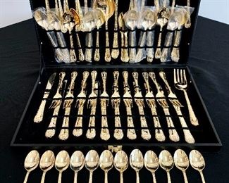 $500 per set. There are TWO sets of gold colored flatware with embellishments on top and bottom of handles. One set has 172 pieces with some serving utensiles. The other set has 175 pieces.