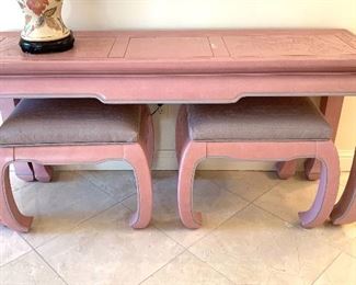 $350. Hand carved, pink, Chinoiserie style, console table with benches. Table measures 56Lx18Wx7H. Minor ware on the top.