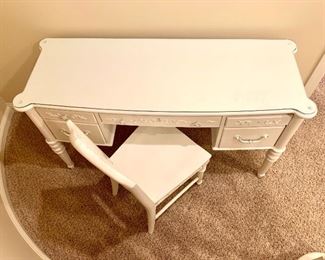 $100. One of 2020's top products! Make this writing desk yours! Painted white, vintage, glass top, solid and functional. Chair included.