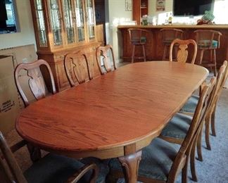 formal dining table with 8 chairs, matching hutch