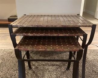 LOT 6619 Set of three nesting metal tables $400