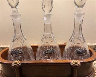 LOT 6661 Set of 3 decanters in wood carrier $80