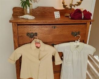 Antique  chest of drawers, vintage children's clothes 