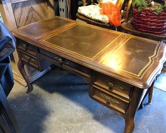 This is a nice desk made by SLIGH... Made in Michigan, good quality with leather top. Only $150.00!