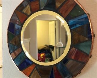 Beveled mirror with colored mosaic edging and copper accents...