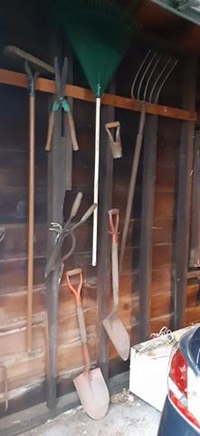 Garage essentials (brooms, rakes, pitchfork, shovels, clippers)