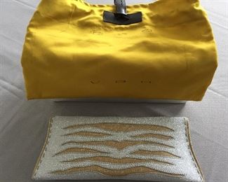 GOLD AND SILVER SPARKLY GLITTER CLUTCH
Condition: Pristine
Grey suede lining. Single wall pocket at interior. Fold-in flap closure at front flap
Dimensions: Width: 12". Height: 5"