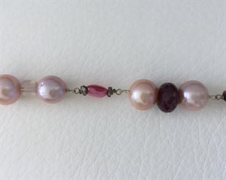 Pearl and bead necklace with: 
Freshwater Pearls
Glass-filled Rubies
Rose Quartz
Tourmaline
Garnet Almondine
Morganite
Wear long (16.5" length) or double it