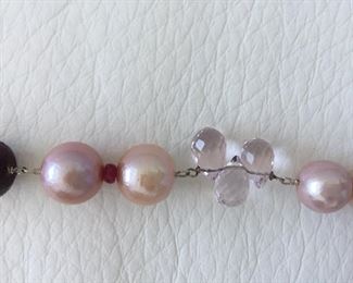 Pearl and bead necklace with: 
Freshwater Pearls
Glass-filled Rubies
Rose Quartz
Tourmaline
Garnet Almondine
Morganite
Wear long (16.5" length) or double it