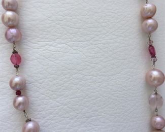 Pearl and bead necklace with: 
Freshwater Pearls
Glass-filled Rubies
Rose Quartz
Tourmaline
Garnet Almondine
Morganite
Wear long (16.5" length) or double it. Stone Identification Report by Appraiser included in this sale. 
