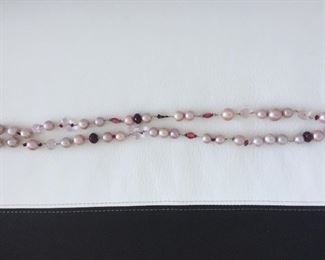 Pearl and bead necklace with: 
Freshwater Pearls
Glass-filled Rubies
Rose Quartz
Tourmaline
Garnet Almondine
Morganite
Wear long (16.5" length) or double it. Stone Identification Report by Appraiser included in this sale.