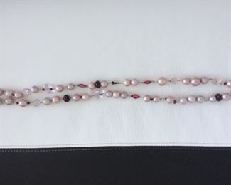 Pearl and bead necklace with:
Freshwater Pearls
Glass-filled Rubies
Rose Quartz
Tourmaline
Garnet Almondine
Morganite
Wear long (16.5" length) or double it. Stone Identification Report by Appraiser included in this sale.