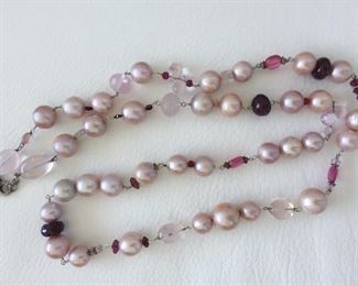 Pearl and bead necklace with: 
Freshwater Pearls
Glass-filled Rubies
Rose Quartz
Tourmaline
Garnet Almondine
Morganite
Wear long (16.5" length) or double it. Stone Identification by appraiser included in this sale.