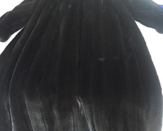 Neiman Marcus FERAUD Paris
Full-length Long Ladies Black Mink Fur Coat
Made in Canada
Estimated retail: $29,000
Extremely high quality. Excellent condition. Excellent, clean lining. Dual slit pockets at sides. Concealed 3 hook-and-eye closures in front. Front-top button for extra warmth. Worn twice. Magnificent sheen on this fur.
This coat has NOT been altered in size from its original purchase.
4 monogrammed initials in inside lining.
Comes with Neiman Marcus dust bag.
APPROXIMATE MEASUREMENTS:
Length from top of shoulder to bottom of coat: 52"
Shoulders: 18"
Sleeve: 26"
Waist: 40"